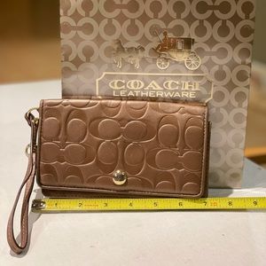 Coach bronze leather wristlet wallet like new